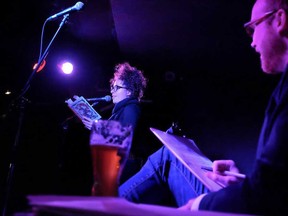 A contributor named Shannon reads something she wrote as a youth before a crowd at a previous GRTTWaK show in Toronto . (Courtesy of Evan Mitsui)