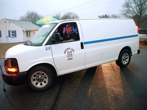 A coroner's van arrives at a wooded area near where the body of Bradley William Stone was discovered, Tuesday, Dec. 16, 2014, in Pennsburg, Pa. The Iraq War veteran suspected of killing his ex-wife and five of her relatives was found dead in the woods near his suburban Philadelphia home Tuesday after a day-and-a-half manhunt that closed schools and left people on edge.  (AP Photo/Matt Rourke)