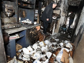 Frank Rubino from BELFOR Property Restoration surveys the damage to Koolini's after an over night fire at the restaurant in Windsor on Thursday, December 25, 2014. The blaze caused extensive damage to the catering business.   (TYLER BROWNBRIDGE/The Windsor Star)