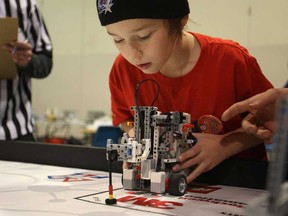 Brandon Argoselo, 10, from the Centreline Supersonics, competes with his team's Lego robot at the 2nd annual F.I.R.S.T Lego League Tournament at St. Clair College, Saturday, Dec. 6, 2014.  (DAX MELMER/The Windsor Star)