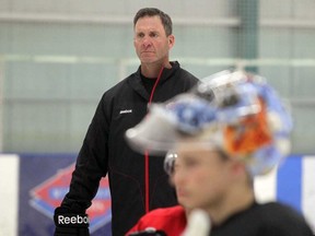 Clint Malarchuk, then goalie coach for the Calgary Flames, takes to the ice during a prospect camp on July 6, 2011. (Leah Hennel/Postmedia News)