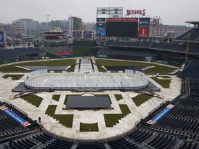 Construction crews work on preparing Nationals Park baseball stadium for the 2015 NHL Winter Classic, on Monday, Dec. 22, 2014, in Washington. The game between the Chicago Blackhawks and Washington Capitals will be played on New Years Day. (AP Photo/Evan Vucci)