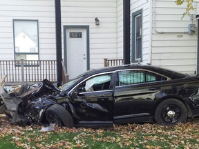 An OPP cruiser that struck a civilian vehicle and then the porch of a residence in St. Joachim on Oct. 24, 2014. (Paul Trepanier / Special to The Star)