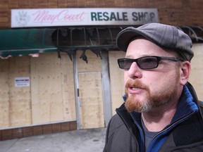 Ward 4 councillor Chris Holt is pictured in front of May Court Resale Shop on Saturday, Dec. 20, 2014. A suspicious fire destroyed the business and Holt is organizing the four business improvement associations in his ward to deal with the recent high number of suspicious fires in the area. (DAX MELMER/The Windsor Star)