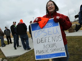 Members of OPSEU Local 135 - which represents the region's corrections workers - picket outside the South West Detention Centre on Dec. 18, 2014. (Tyler Brownbridge / The Windsor Star)