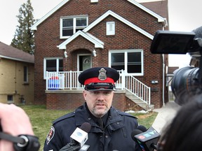 Sgt. Matthew D'Asti of Windsor police speaks to media in front of 1566 Benjamin Ave. on Dec. 11, 2014. (Dan Janisse / The Windsor Star)
