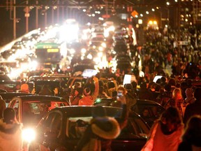 Vehicles are gridlocked on the West Side Highway by a crowd of protesters after it was announced that the New York City police officer involved in the death of Eric Garner was not indicted, Wednesday, Dec. 3, 2014, in New York. A grand jury cleared the New York City police officer Wednesday in the videotaped chokehold death of Garner, an unarmed black man, who had been stopped on suspicion of selling loose, untaxed cigarettes, a lawyer for the victim's family said. (AP Photo/Julio Cortez)