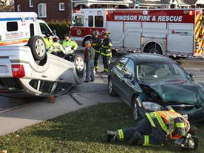 Emergency responders work at the scene of a two-vehicle crash at Pierre Avenue and Ellis Street East on Dec. 1, 2014. (Dan Janisse / The Windsor Star)