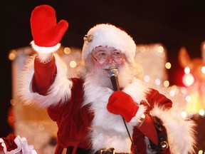 Larry Glendenning, playing the part of Santa Claus, waves to those attending the Windsor Santa Claus Parade in the town of Sandwich, Saturday, Dec. 3, 2011.   (DAX MELMER/The Windsor Star)