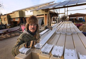 Aleks Stevanov is shown at his Windsor, ON. home on in the 4000 block of Baseline Rd. on Thursday, Dec. 11 2014. Some of his neighbours are upset with the solar panels he is installing on his house.  (DAN JANISSE/The Windsor Star)