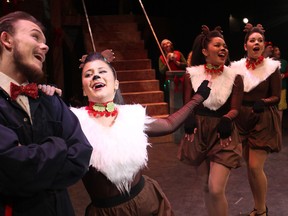 Phillip Cooper, left, as the grumpy janitor, and Olivia Gogas, as one of Santa's reindeer, rehearse A St. Clair Christmas at the St. Clair Centre for the Performing Arts, Friday, Dec. 5, 2014.  (DAX MELMER/The Windsor Star)