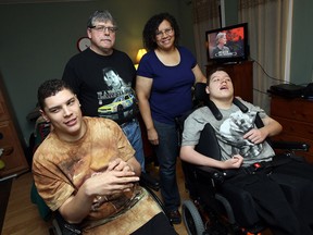 Max Knight-Shank, left, Terry Shank, Shirley Knight and Joshua Knight-Shank are shown in their family home in Windsor recently. (TYLER BROWNBRIDGE / The Windsor Star)