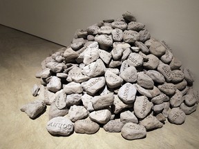 The “Sorry” rocks, by Hamilton-area artist Donna Akrey, are part of the new exhibit in Possible Futures: What is to be done? at the Art Gallery of Windsor. (TYLER BROWNBRIDGE / The Windsor Star)