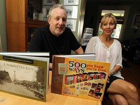 Chris Edwards and Elaine Weeks with their book A Forgotten City at their home in Windsor, in this October 2013 photo.              (TYLER BROWNBRIDGE / Windsor Star files)