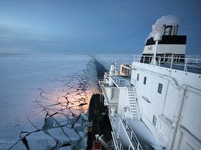 This handout photo provided by Russian gas giant Gazprom press service on November 15, 2012 shows the Ob River tanker able to carry liquified natural gas (LNG) sailing somewhere in the undisclosed location in the Arctic. Due to global warming ice is melting rapidly in the Arctic region, opening up for a new shorter shipping route between Europe and Asia. In 2012 46 ships sailed the Northern Sea Route up from only two in 2010.AFP PHOTO / GAZPROM