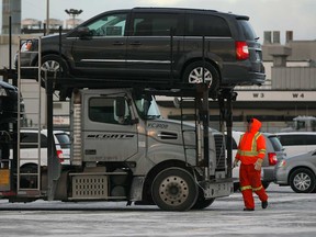 Windsor-built 2015 Dodge Grand Caravans and Chrysler Town and Country minivans leave Windsor Assembly Plant after rolling off the line Monday, Jan. 5, 2015. (NICK BRANCACCIO/The Windsor Star)