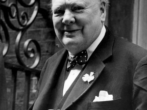 This is a June 24, 1952, file photo of Britain's WWII leader Winston Churchill outside the door of 10 Downing Street, London.  (AP Photo, File)