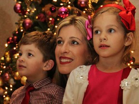 Milica Vizirakis and her children George, 3, and Yianna, 4, enjoy Serbian Orthodox Christmas at Serbian Community Centre January 6, 2015. A traditional badnjak, a cluster of oak branches, was carried into the hall by President Gracanica Peter Dobrich and Vice President Gracanica Nikola Zubic for the festive event attened by over 600. (NICK BRANCACCIO/The Windsor Star)