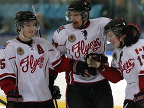 Leamington Flyers goalscorer Alex Friesen, right, is congratulated by teammates Jacob McGhee, left, and Travis Campbell in game against LaSalle Vipers in Junior 'B' hockey action from Vollmer Centre Wednesday January 7, 2015. (NICK BRANCACCIO/The Windsor Star)