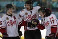 Leamington Flyers goalscorer Alex Friesen, right, is congratulated by teammates Jacob McGhee, left, and Travis Campbell in game against LaSalle Vipers in Junior 'B' hockey action from Vollmer Centre Wednesday January 7, 2015. (NICK BRANCACCIO/The Windsor Star)