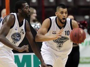 Chris Commons, left, and Kevin Loiselle grab a rebound against Brampton in NBL Canada league action from WFCU Centre January 8, 2015. (NICK BRANCACCIO/The Windsor Star)