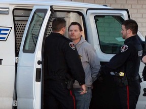 Windsor Police take a man into custody at Husky Truck Stop on County Road 46 following a manhunt, Wednesday January 7, 2015. (NICK BRANCACCIO/The Windsor Star)