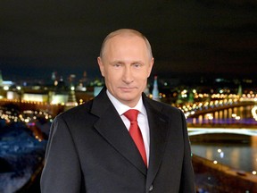 Russian President Vladimir Putin stands during a TV address to the nation on December 31, 2014 in Moscow. (Getty Images files)