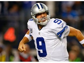 ARLINGTON, TX - JANUARY 04: Tony Romo #9 of the Dallas Cowboys reacts after the Cowboys score against the Detroit Lions during the second half of their NFC Wild Card Playoff game at AT&T Stadium on January 4, 2015 in Arlington, Texas. (Photo by Tom Pennington/Getty Images)