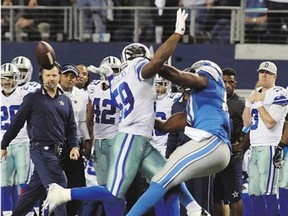 Dallas Cowboys linebacker Anthony Hitchens is hit in the back by a pass intended for Detroit Lions tight end Brandon Pettigrew during Sunday's NFL wild-card game in Dallas.
( Paul Moseley, The Associated Press , The Associated Press)