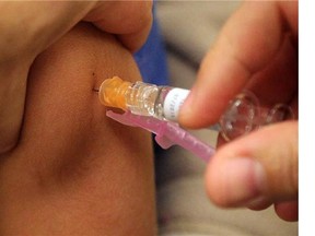 Adverse vaccine reactions rare, seldom serious: report. (Postmedia News files)
