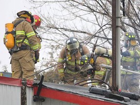 Amherstburg firefighters work on a fire at Allen's Supermarket in McGregor on Saturday, Jan. 3, 2014. (DAX MELMER/The Windsor Star)
