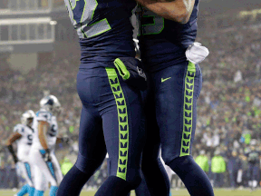 Seattle Seahawks tight end Luke Willson, right, celebrates with wide receiver Jermaine Kearse after catching a 25-yard touchdown pass against the Carolina Panthers during the second half Saturday in Seattle. (AP Photo/Elaine Thompson)