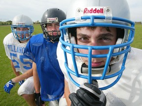 Portrait of brothers - (L to R)  Eric, Greg and Luke Willson are pictured on Sept. 28, 2005. The three brothers play for the Villanova Senior Boys Football team.  (JASON KRYK/The Windsor Star)