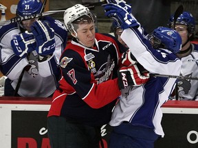 Spits Logan Stanley, left, stops Wolves Brody Silk in first period of OHL action from WFCU Centre, Thursday January 15, 2015. (NICK BRANCACCIO/The Windsor Star)
