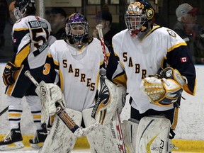 LaSalle Sabres goalies Kristen Swiatoschik, right, and Erica Fryer prepare for s game against Windsor Junior Spitfires at the Riverside Tournament. (NICK BRANCACCIO/The Windsor Star)