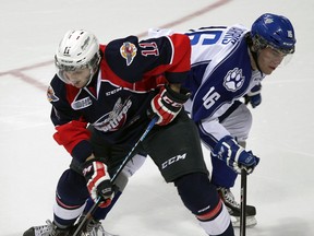 Windsor's Lucas Venuto, left, tangles with Sudbury's Jacob Harris in the first period Thursday at the WFCU Centre. (NICK BRANCACCIO/The Windsor Star)