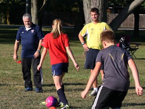 Tecumseh Soccer Club coaches Steve Grigorakis, far left, shown in this September 2013 file photo, was among the members of the Windsor and District Soccer League to resign in 2014. Grigorakis said he has reservations about a new plan to appoint a single administrator for the league. (NICK BRANCACCIO/The Windsor Star)