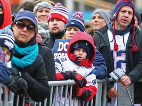 BOSTON, MA - JANUARY 26: Fans attend the New England Patriots Send-Off Rally at City Hall Plaza on January 26, 2015 in Boston, Massachusetts. The Patriots will face the Seattle Seahawks in Superbowl XLIX on Sunday. (Photo by Maddie Meyer/Getty Images)