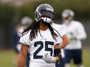 TEMPE, AZ - JANUARY 29:  Cornerback Richard Sherman #25 of the Seattle Seahawks warms up during a practice at Arizona State University on January 29, 2015 in Tempe, Arizona.  (Photo by Christian Petersen/Getty Images)
