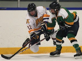 Kennedy's Joey Bray, left, and Lajeunesse's Lawson Veilleux collide during a game Monday at Adie Knox Arena. (DAN JANISSE/The Windsor Star)