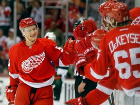 Detroit's Teemu Pulkkinen, left, celebrates his first NHL goal against the Minnesota Wild.