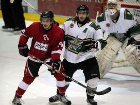 Flyers Matthew Opblinger, left, against St. Thomas Stars Blair Mincer in Greater Ontario Junior Hockey League action from Heinz Arena in Leamington, January 22, 2015. Tyler Duarte scored in overtime, Leamington won, 4-3. (NICK BRANCACCIO/The Windsor Star)