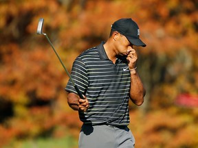 Tiger Woods reacts to a missed birdie putt on the 11th green during the first round of the Hero World Challenge at the Isleworth Golf & Country Club on December 4, 2014 in Windermere, Florida.  (Photo by Scott Halleran/Getty Images)
