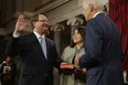 Sen. Gary Peters (D-MI) (L) is ceremonially sworn in by Vice President Joe Biden in the Old Senate Chamber with Peters' wife Colleen Ochoa at the U.S. Capitol January 6, 2015 in Washington, DC. (Chip Somodevilla/Getty Images)