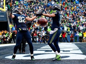 Luke Willson #82 of the Seattle Seahawks celebrates after scoring on a two point conversion during the fourth quarter of the 2015 NFC Championship game against the Green Bay Packers at CenturyLink Field on January 18, 2015 in Seattle, Washington.  (Photo by Tom Pennington/Getty Images)