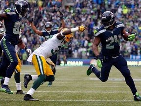 Marshawn Lynch #24 of the Seattle Seahawks runs the ball in for a touchdown during the fourth quarter of the 2015 NFC Championship game against the Green Bay Packers at CenturyLink Field on January 18, 2015 in Seattle, Washington.  (Otto Greule Jr/Getty Images)