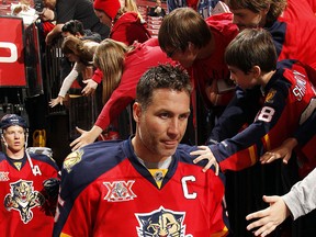 Ed Jovanovski #55 of the Florida Panthers is greeted by fans while heading out to the ice prior to the start of the game against the Calgary Flames at the BB&T Center on April 4, 2014 in Sunrise, Florida. (Photo by Eliot J. Schechter/NHLI via Getty Images)