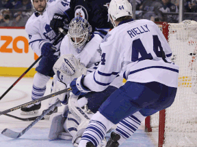 LaSalle's Zack Kassian, right, checks Detroit's Xavier Ouellet during third-period action in Vancouver. (THE CANADIAN PRESS/Darryl Dyck)