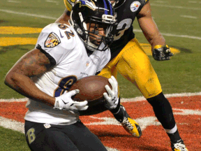 Baltimore wide receiver Torrey Smith, left, catches a touchdown past Pittsburgh free safety Mike Mitchell in the third quarter Saturday night in Pittsburgh. (AP Photo/Don Wright)