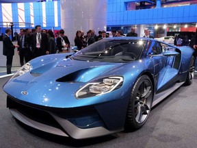 The new Ford GT is pictured at The North American International Auto Show in Detroit, Michigan, on January 12, 2015. Ford attempted to land a knock-out blow to its rivals at the Detroit auto show in revealing a dazzling new GT supercar. The annual car show takes place amid a surging economy, more jobs and cheap gas, a trifecta of near-perfect conditions for the US auto industry. (JEWEL SAMAD/AFP/Getty Images)